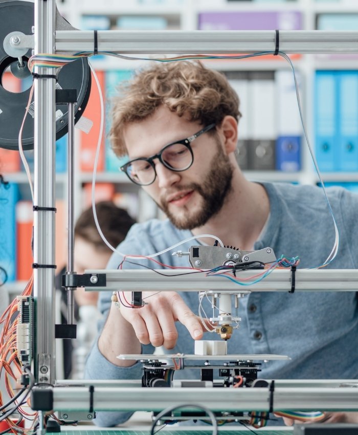 Teacher using 3D printer